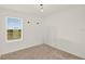 Bedroom featuring carpet flooring and a bright window with a view at 271 Inman Blvd, Winter Haven, FL 33881
