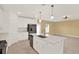 Bright kitchen featuring a spacious island, stainless steel appliances and contemporary pendant lighting at 271 Inman Blvd, Winter Haven, FL 33881
