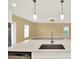 Bright kitchen featuring a spacious island, modern appliances and pendant lights at 271 Inman Blvd, Winter Haven, FL 33881