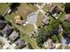 Overhead view of neighborhood featuring well-manicured lawns, mature trees, and cul-de-sac at 4462 Iris S St, Lakeland, FL 33813