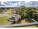 Aerial view of a home with solar panels and a fenced backyard in a residential neighborhood at 4462 Iris S St, Lakeland, FL 33813