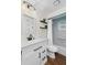 Updated bathroom featuring white vanity, modern fixtures, and shower-tub combination at 4462 Iris S St, Lakeland, FL 33813