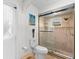 The tiled bathroom features a glass-enclosed shower with modern fixtures and tiled surround at 4462 Iris S St, Lakeland, FL 33813