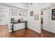 Open dining area with dark wood floors, a coffee bar, and views of other living spaces at 4462 Iris S St, Lakeland, FL 33813