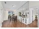 Dining room with a mirrored wall, open to the kitchen and overlooking the patio at 4462 Iris S St, Lakeland, FL 33813