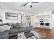 Relaxing living room with a large gray sectional sofa, modern decor, and a breakfast bar at 4462 Iris S St, Lakeland, FL 33813