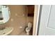 Powder bathroom with a simple design, perfect for guests using the pool at 7810 Whitemarsh Way, Reunion, FL 34747
