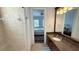 Bathroom sink and counter plus view into main bedroom at 7810 Whitemarsh Way, Reunion, FL 34747
