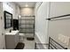 Modern bathroom with a sleek glass-enclosed shower, contemporary vanity, and stylish fixtures at 7810 Whitemarsh Way, Reunion, FL 34747