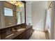 Bathroom with granite counters, a sink, a toilet and tub shower combo at 7810 Whitemarsh Way, Reunion, FL 34747