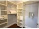 Walk-in closet with custom shelves and storage at 7810 Whitemarsh Way, Reunion, FL 34747