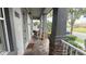 Cozy front porch with comfortable seating, perfect for relaxing and enjoying the neighborhood at 7810 Whitemarsh Way, Reunion, FL 34747