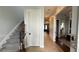 Hallway features a staircase and entrances to other rooms in the house at 7810 Whitemarsh Way, Reunion, FL 34747