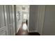 Hallway on the upper level with multiple closets and natural light at 7810 Whitemarsh Way, Reunion, FL 34747