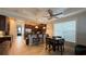 Eat in kitchen area featuring dark wood cabinetry, granite countertops, stainless steel appliances and pendant lighting at 7810 Whitemarsh Way, Reunion, FL 34747
