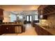 Open kitchen features granite countertops, tile flooring, and flows into living area at 7810 Whitemarsh Way, Reunion, FL 34747
