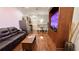 A comfortable living room offers sleek hardwood floors and an open kitchen, ideal for modern living at 7810 Whitemarsh Way, Reunion, FL 34747