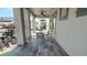 Charming patio features stone floors, ceiling fan and a view of the surrounding neighborhood at 7810 Whitemarsh Way, Reunion, FL 34747