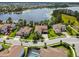Expansive aerial view showcasing a beautiful lakefront property and the surrounding neighborhood at 9080 Morgana Ct, Winter Garden, FL 34787