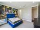 Nicely appointed bedroom with colorful mural accent wall, carpet and trim at 9080 Morgana Ct, Winter Garden, FL 34787