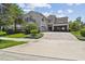 Stunning two-story home featuring lush landscaping and a circular driveway, blending elegance with curb appeal at 9080 Morgana Ct, Winter Garden, FL 34787