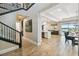 Inviting foyer with a staircase flowing into an open-concept living space and elegant dining area at 9080 Morgana Ct, Winter Garden, FL 34787