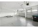 Spacious three-car garage with plenty of room for storage, projects, and parking at 9080 Morgana Ct, Winter Garden, FL 34787