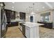 Modern kitchen with a large island, stainless steel appliances, and abundant cabinet space, perfect for cooking at 9080 Morgana Ct, Winter Garden, FL 34787