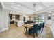Open-concept kitchen and dining area with seamless access to outdoor views and a refreshing pool at 9080 Morgana Ct, Winter Garden, FL 34787