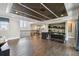 Open living area with hardwood floors, custom ceilings, and bar at 9080 Morgana Ct, Winter Garden, FL 34787