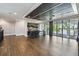 Expansive living room with hardwood floors, bar, and access to outdoor balcony at 9080 Morgana Ct, Winter Garden, FL 34787