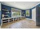 Bright office space with custom built-ins, wood flooring, and large windows at 9080 Morgana Ct, Winter Garden, FL 34787