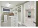 Spacious walk-in closet with custom shelves, drawers, and carpet flooring at 9080 Morgana Ct, Winter Garden, FL 34787