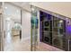 Contemporary wine cellar with glass doors and decorative lighting at 9080 Morgana Ct, Winter Garden, FL 34787