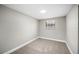 Cozy bedroom features neutral carpet, and a bright window with natural light at 1022 Baycrest Dr, Lakeland, FL 33805
