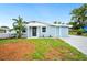Charming home with a freshly painted blue exterior, a well-manicured lawn, and a paved driveway at 1022 Baycrest Dr, Lakeland, FL 33805