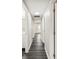 Bright hallway with dark wood flooring, neutral walls, and white trim at 1022 Baycrest Dr, Lakeland, FL 33805