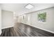 Open-concept living room features dark wood floors and ample natural light at 1022 Baycrest Dr, Lakeland, FL 33805