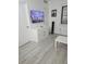 Bedroom with a mounted TV and a window at 7601 Canada Ave # 220, Orlando, FL 32819