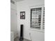 Bedroom with window and white wood blinds at 7601 Canada Ave # 220, Orlando, FL 32819