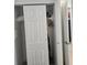 Organized closet space featuring shelving, ironing board, and ample storage at 7601 Canada Ave # 220, Orlando, FL 32819