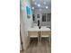 Bright dining area with white table set, entertainment center, and modern decor at 7601 Canada Ave # 220, Orlando, FL 32819