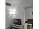 Comfortable living room showing a TV atop a dresser and a floral sofa for cozy viewing at 7601 Canada Ave # 220, Orlando, FL 32819