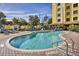 Inviting outdoor pool area surrounded by lounge chairs for relaxation and sunbathing at 7601 Canada Ave # 220, Orlando, FL 32819