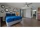 Bedroom featuring a blue bed, gray walls and wood-look tile flooring at 107 Elm N Sq, Lakeland, FL 33813