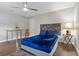 Bedroom featuring a blue bed, gray walls and wood-look tile flooring at 107 Elm N Sq, Lakeland, FL 33813