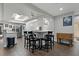 Bright dining area with modern lighting and ample space for entertaining at 107 Elm N Sq, Lakeland, FL 33813