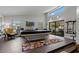 Bright game room with a pool table and sliding glass doors to outdoor patio at 107 Elm N Sq, Lakeland, FL 33813