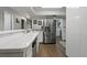 Bright kitchen featuring white tile countertops and stainless steel refrigerator at 107 Elm N Sq, Lakeland, FL 33813