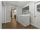 Laundry room featuring new washer and dryer next to a bathroom at 107 Elm N Sq, Lakeland, FL 33813